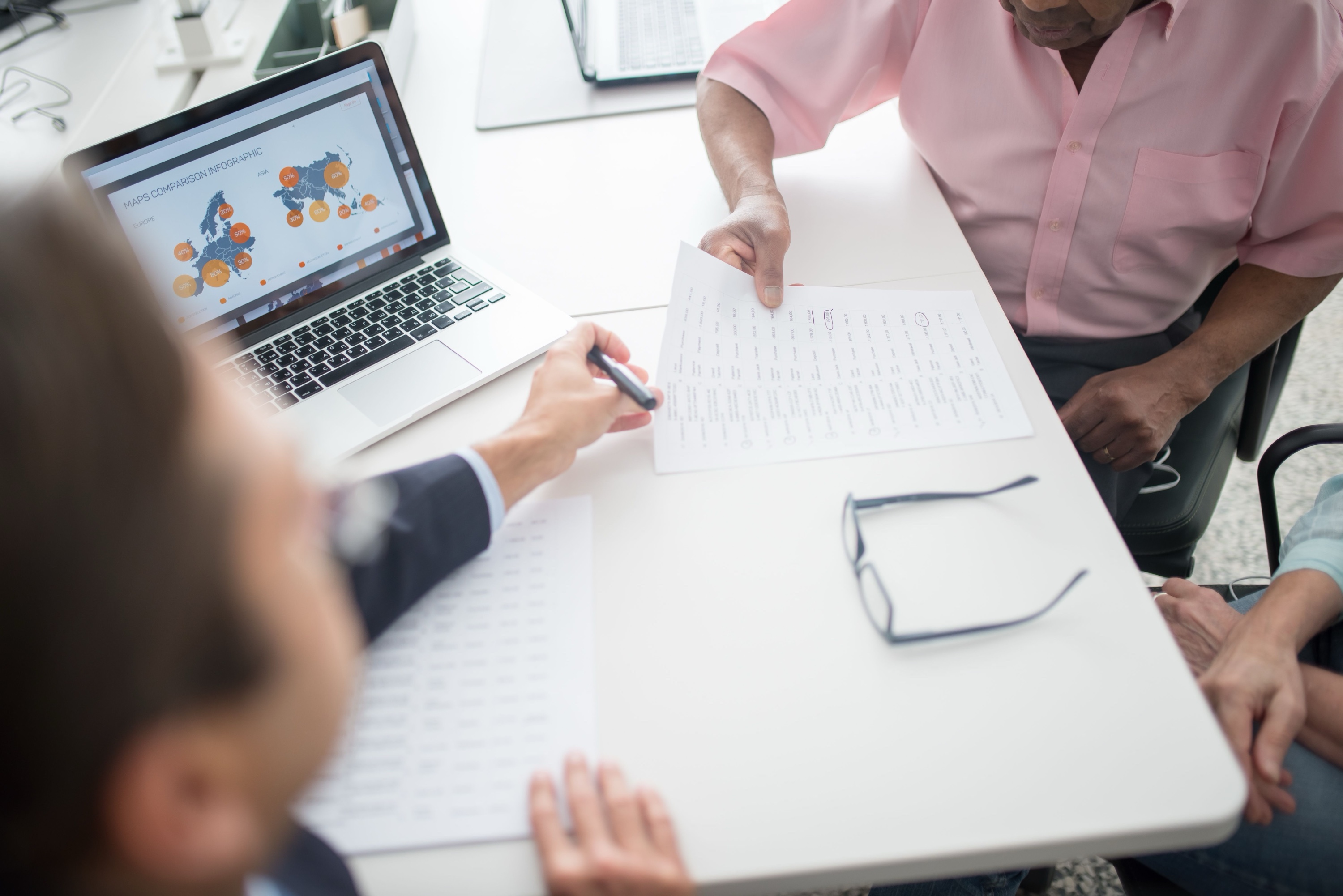 Business advisors discussing international growth
